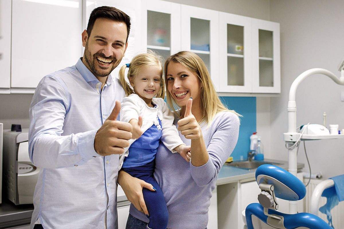 Happy family at dental clinic