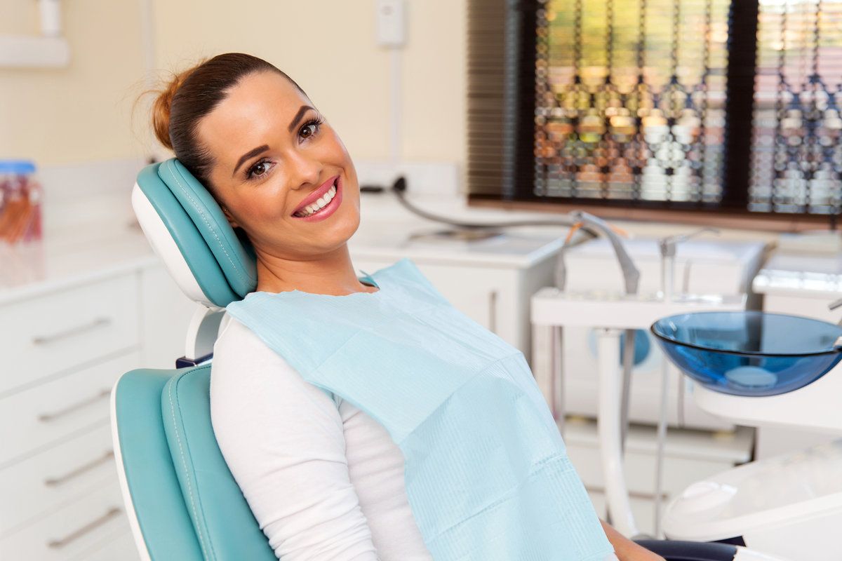 Smiling woman in dental clinic chair