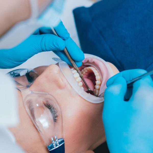 Dental examination with patient receiving treatment