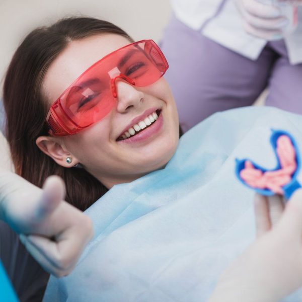 Patient smiling during dental treatment